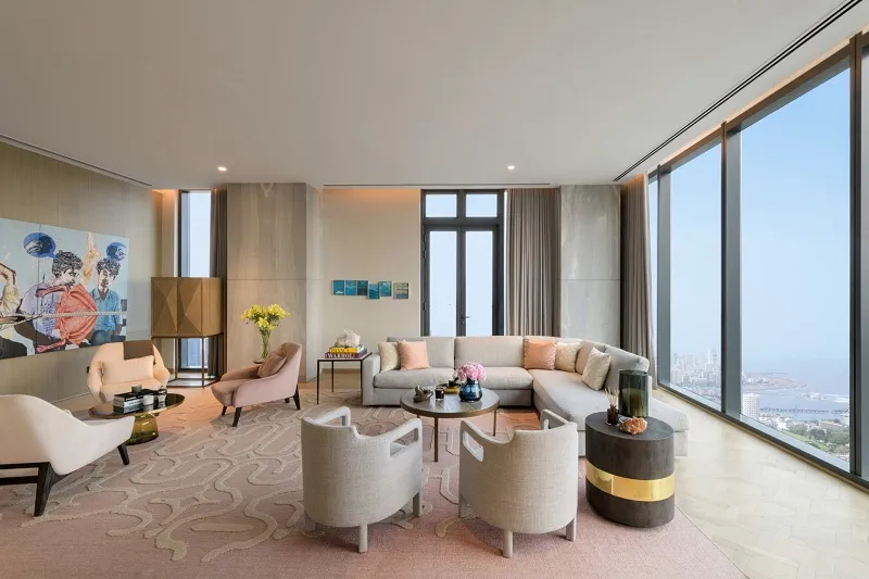 Living room with orange sofa and wooden partition